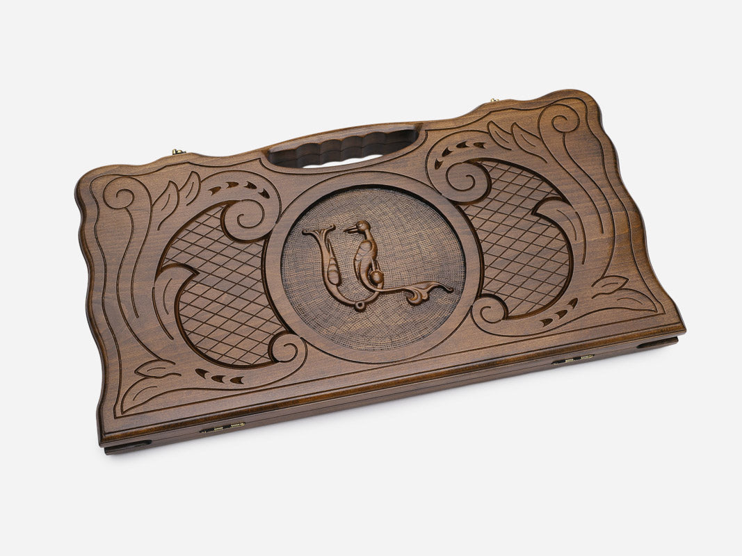 Angled view of the handmade backgammon set showing the carved lid
