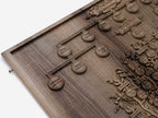 Close-up of the carved trunk and roots in walnut