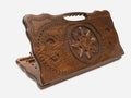Carved beechwood backgammon board with a snowflake ornament and a carry handle, propped open