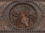 The cut-out carry handle and the upper carving of the lid