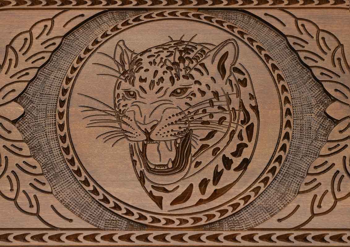 The braided border carved around the edge of the board
