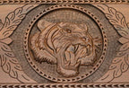 The cut-out carry handle and the upper carving of the lid