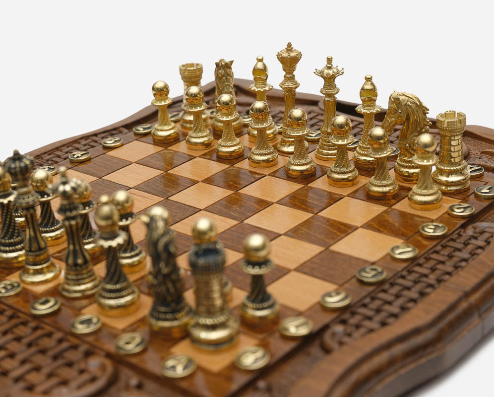 Bronze chess pieces on turned bases, walnut board