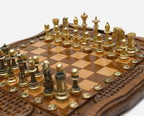 Bronze chess pieces on turned bases, walnut board