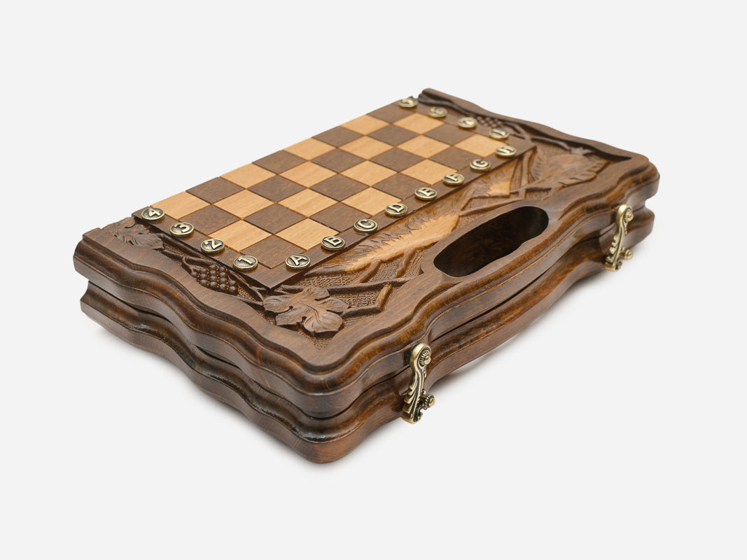 Hand-carved side border of the walnut game board