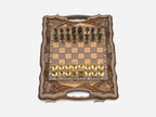 Close-up of gold and silver figural metal chess pieces