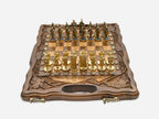 Walnut chess and backgammon set open to the chessboard with figural metal pieces