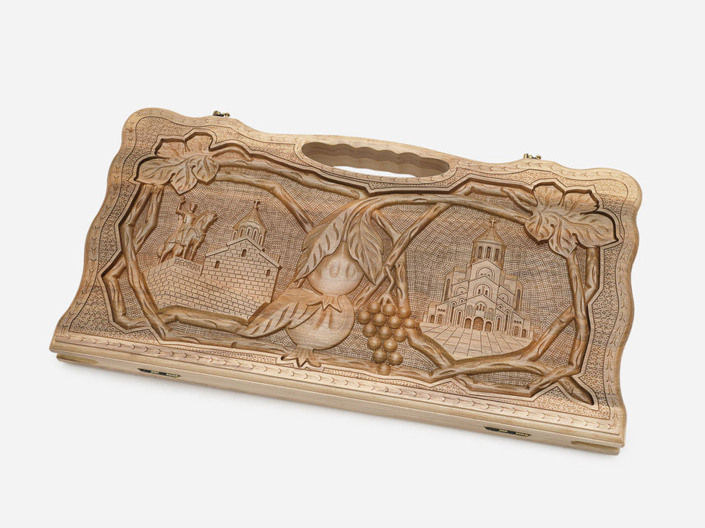Angled view of the luxury walnut Georgian backgammon set showing the carved lid