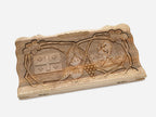 Close-up of the five-fold Georgian cross carved deep into walnut