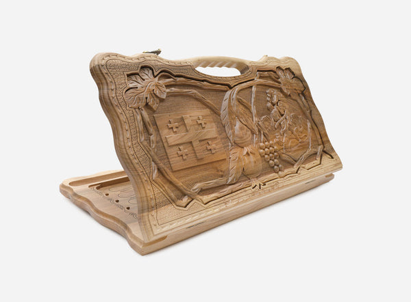 Carved walnut Georgian backgammon board with the five-fold cross and a cut-out carry handle, propped open