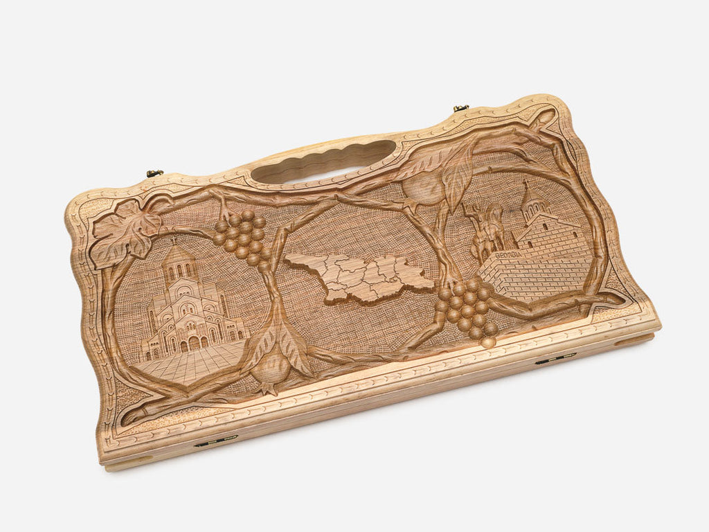 Angled view of the luxury walnut Georgian backgammon set showing the carved lid