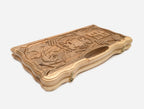 Side view of the folded walnut board showing its bronze hinges