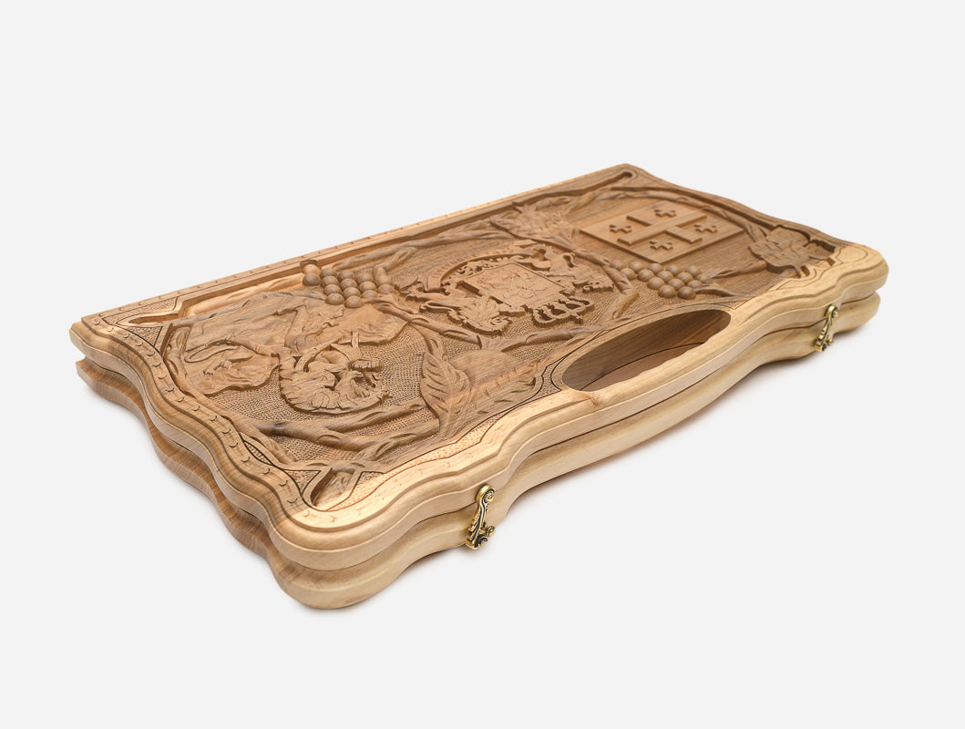 Side view of the folded walnut board showing its bronze hinges