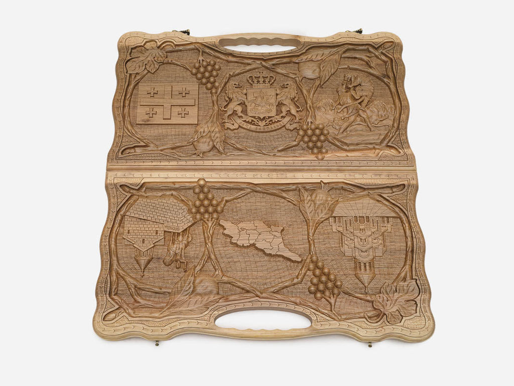 The cut-out carry handle and the upper vine carving