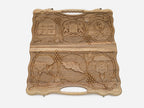 The cut-out carry handle and the upper vine carving