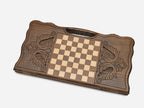 Close-up of the bold ornament carved at the centre of the board