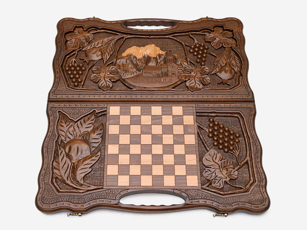 The cut-out carry handle and the carved border of the board