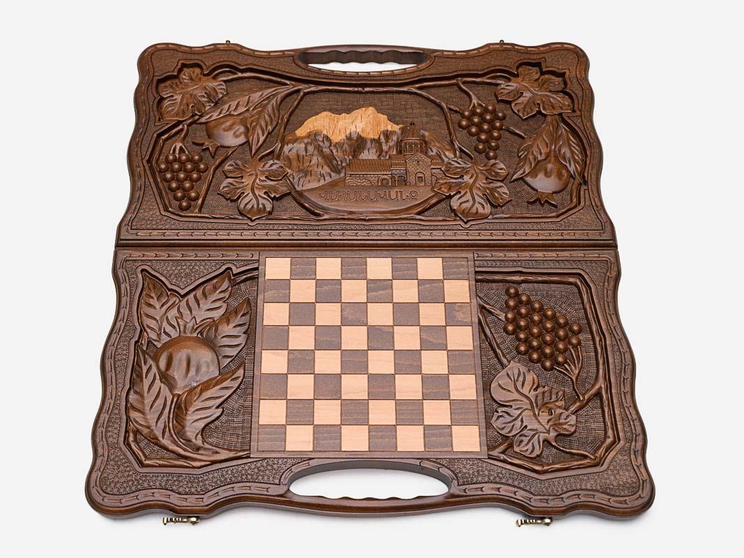 The cut-out carry handle and the carved border of the board