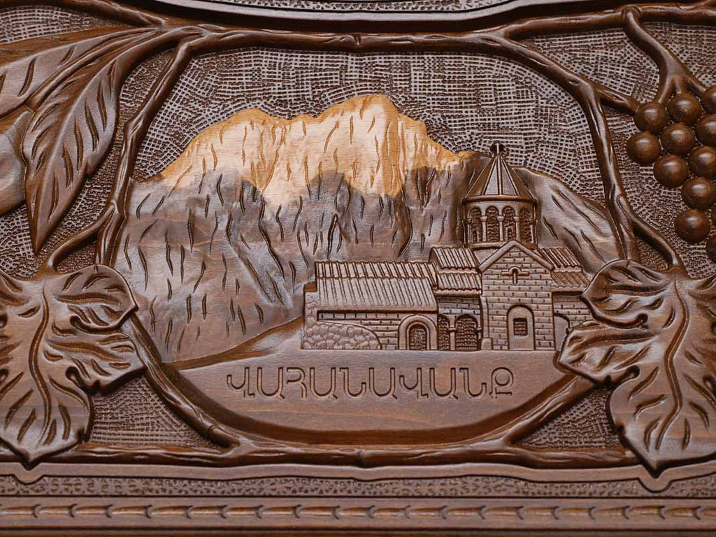 Close-up of the carved monastery and mountain landscape