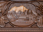 Close-up of the carved monastery and mountain landscape