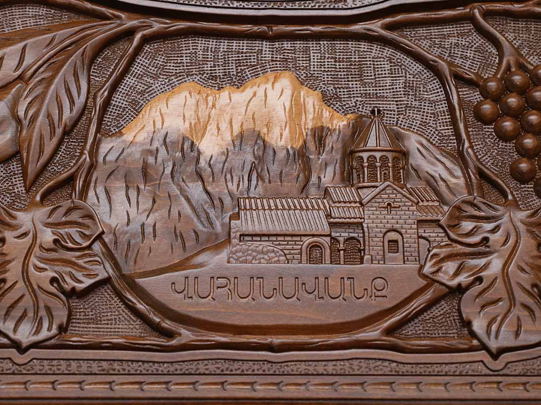 Close-up of the carved monastery and mountain landscape