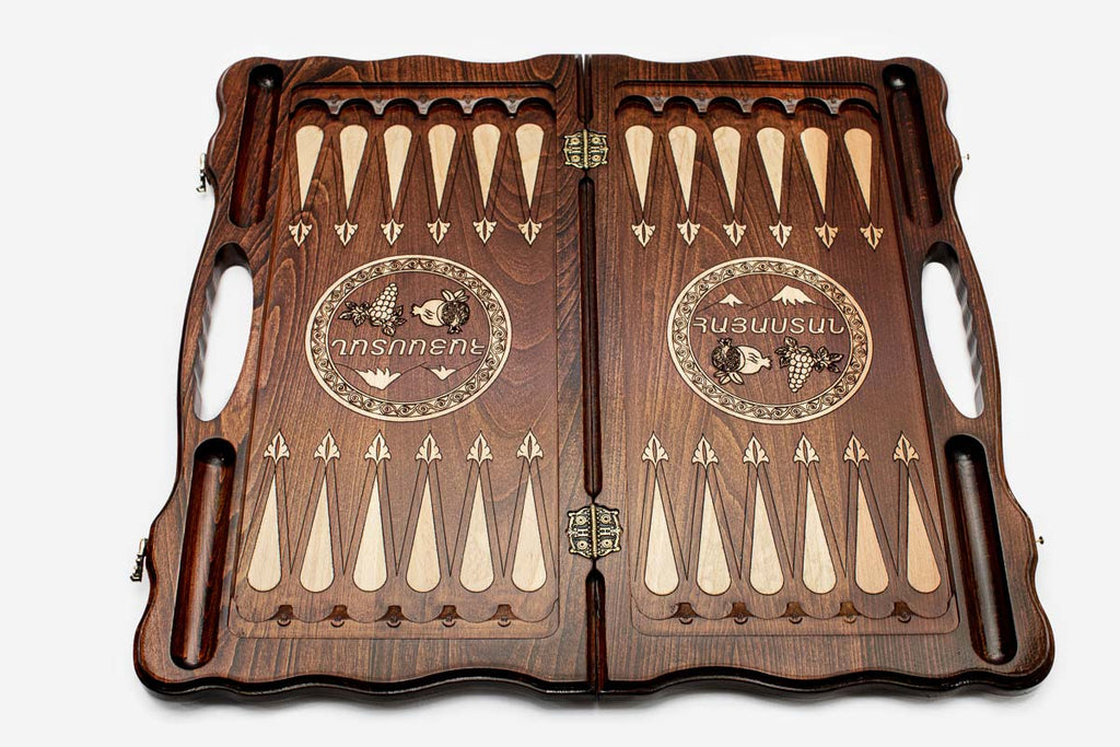 Side view of the folded board showing its bronze hinges and clasps