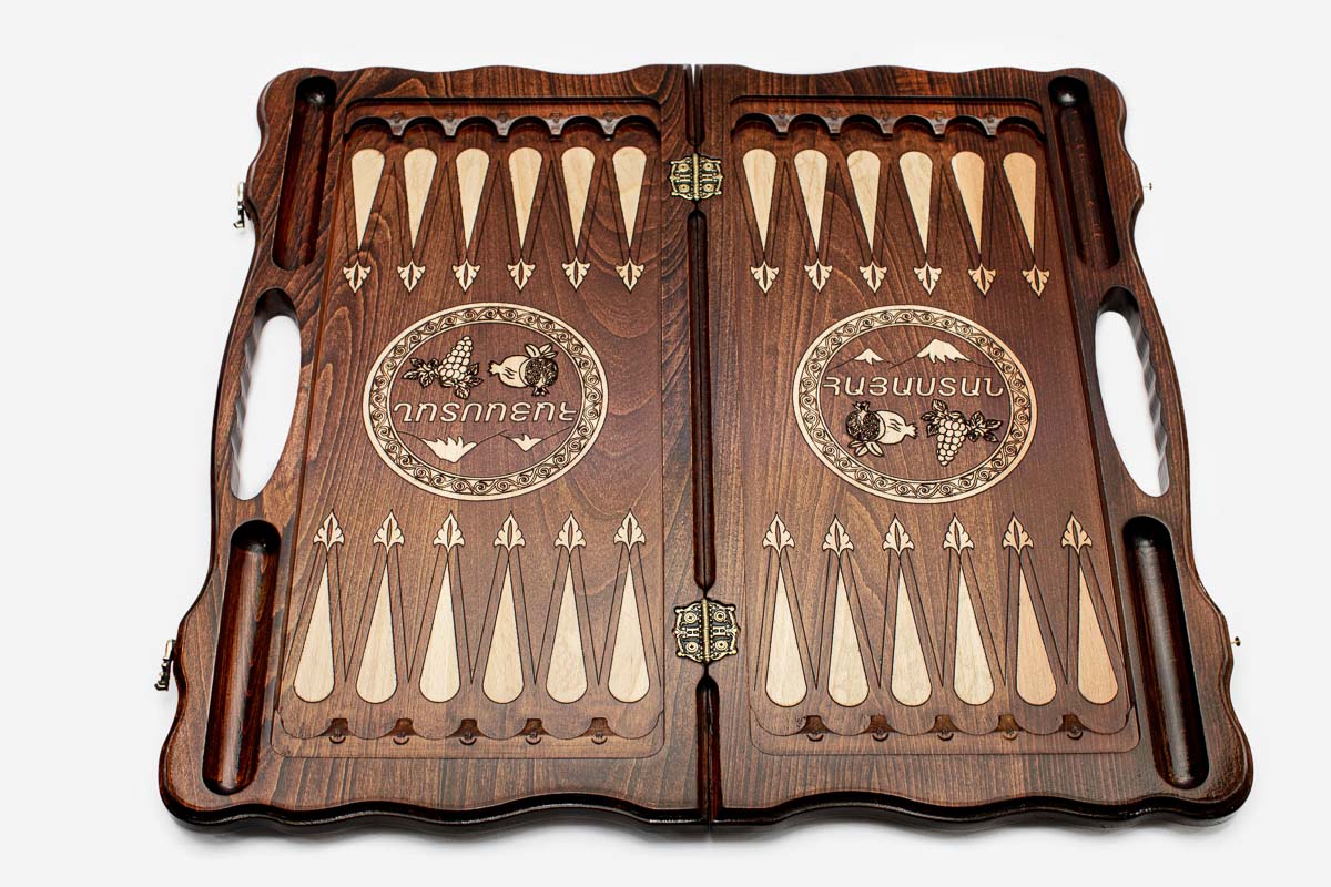 Side view of the folded board showing its bronze hinges and clasps