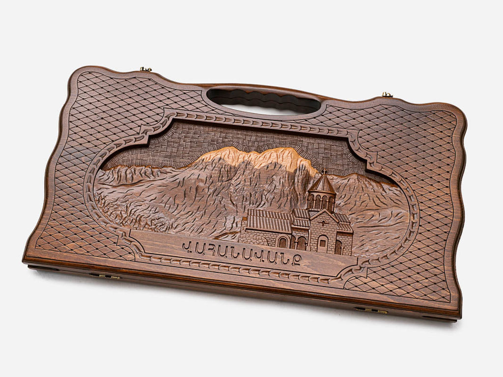 Angled view of the luxury Armenian backgammon set showing the carved landscape