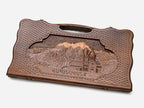 Angled view of the luxury Armenian backgammon set showing the carved landscape