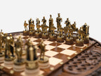 Close-up of the castle rook piece beside the standing knight figures
