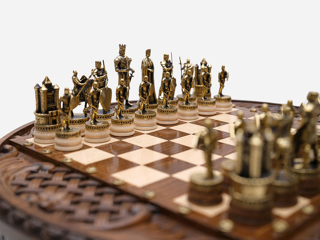 Close-up of the castle rook and royal figures on the Chess Royal Circle board