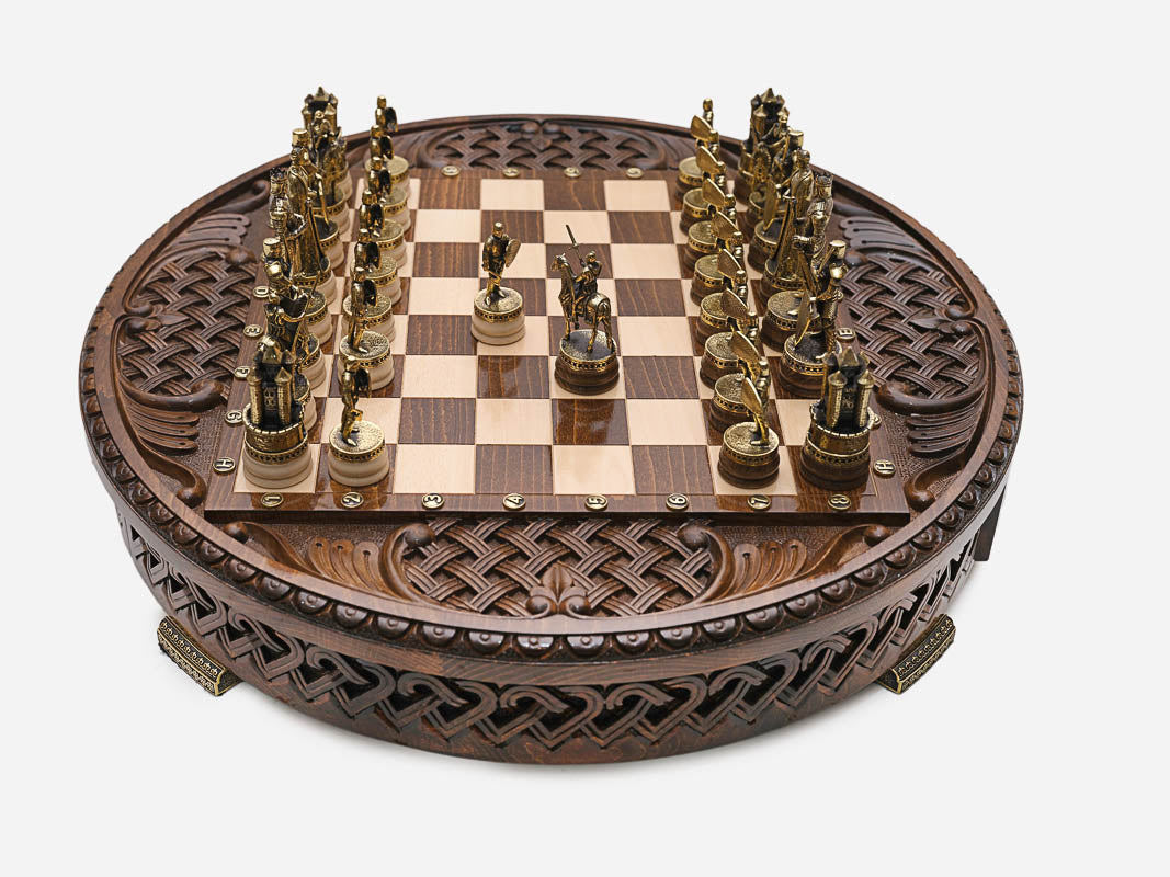 Royal Circle round chess board with pieces in starting position, closer front view