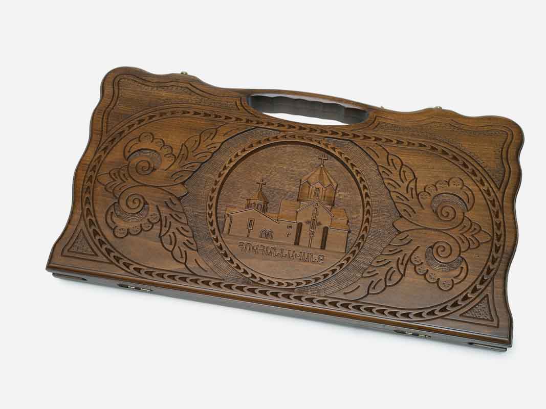 Carved Armenian backgammon board with the Hovhannavank monastery and a cut-out carry handle, shown closed
