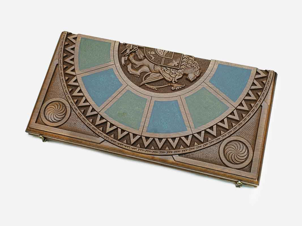 Close-up of the carved Armenian coat-of-arms relief at the center of the board