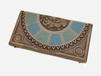Close-up of the carved Armenian coat-of-arms relief at the center of the board