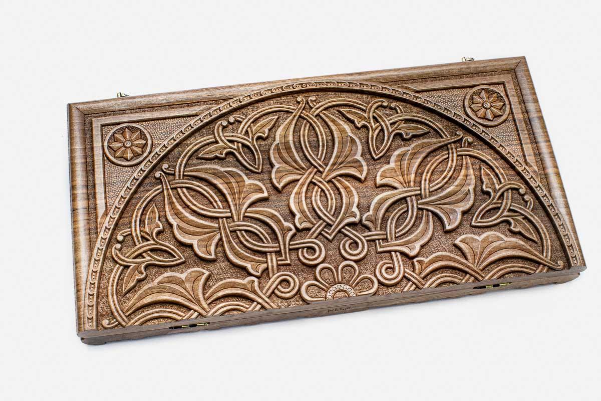 Master-carved walnut backgammon board, side view