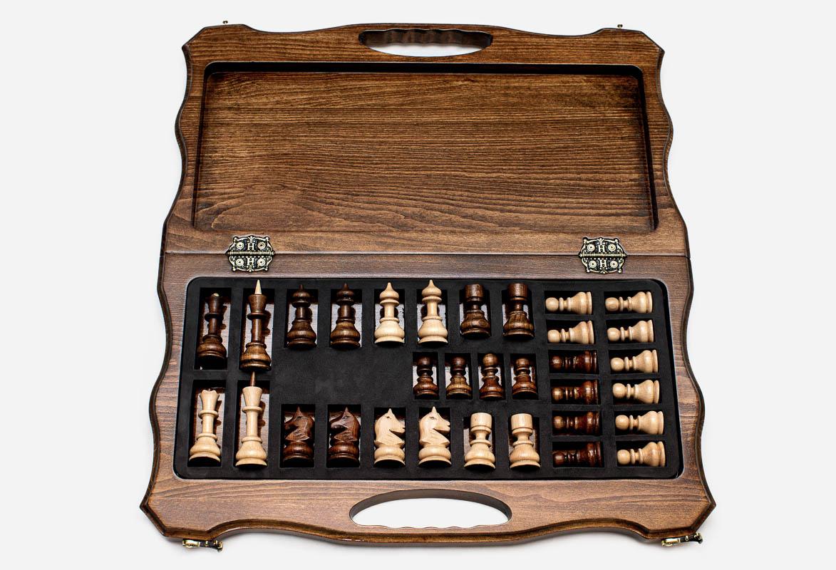 Overhead view of the folding chess board and the full set of 32 pieces