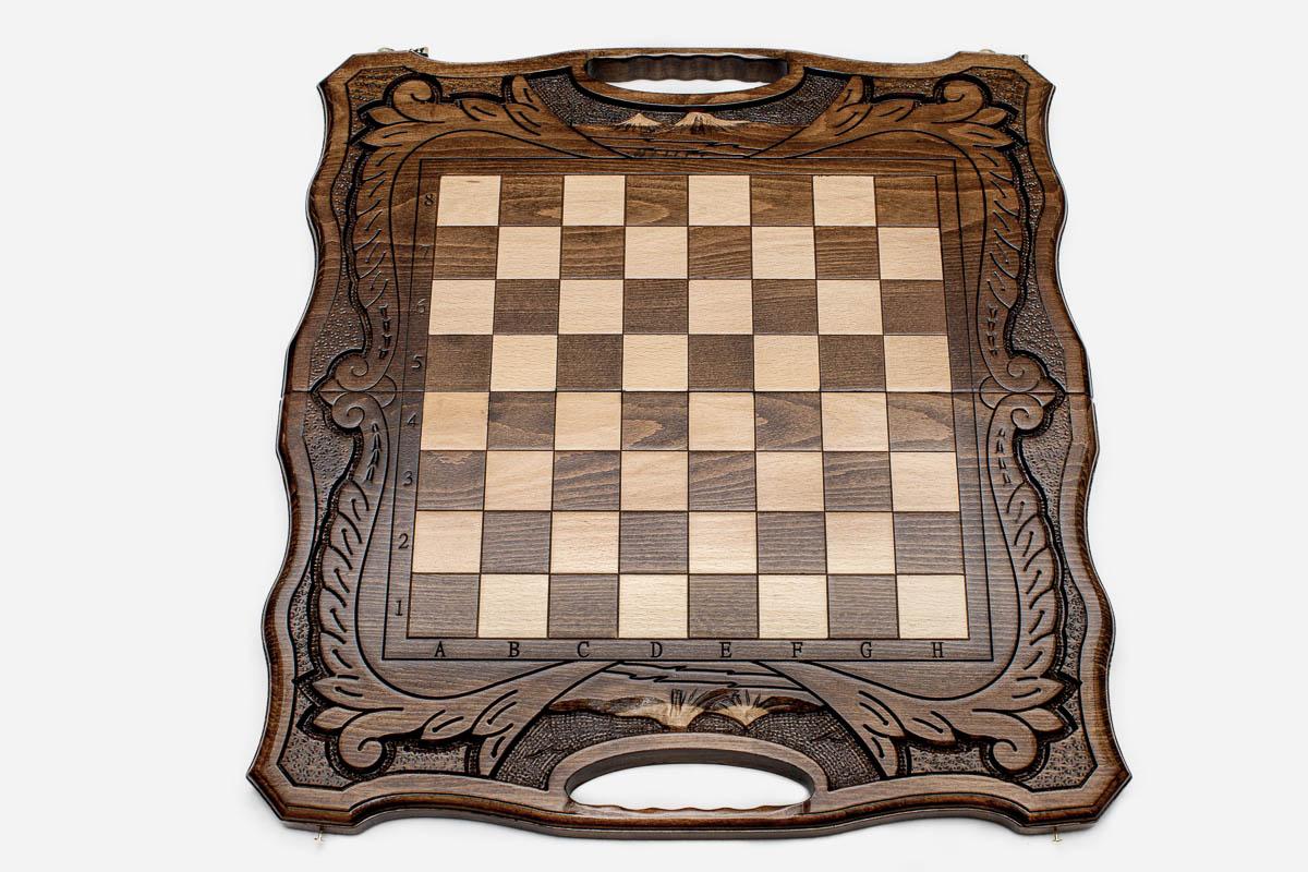 Close-up of the turned beech and walnut chess pieces on the inlaid squares