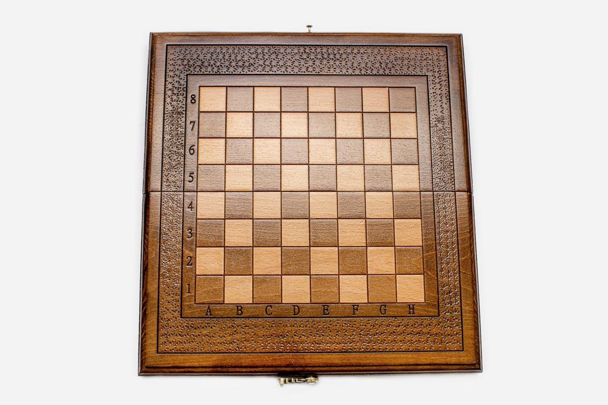 Clean hand-carved border on a classic wooden chess board - detail