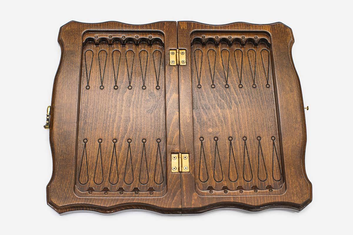 Classic hand-carved border on a wooden travel chess board - detail