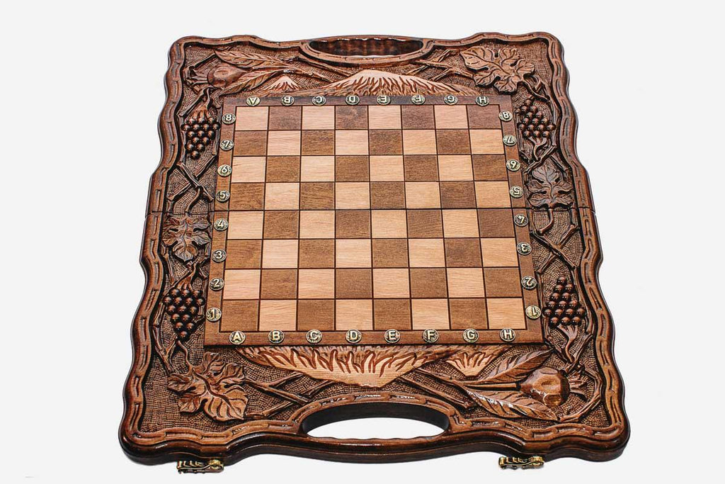 Angled view of the pomegranate harvest chess set with its beech and walnut pieces