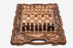 Luxury Armenian walnut chess set carved with pomegranates and grape vines, pieces set up for play
