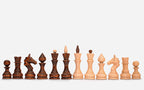Angled view of the folded walnut chess set ready to lift by its handle
