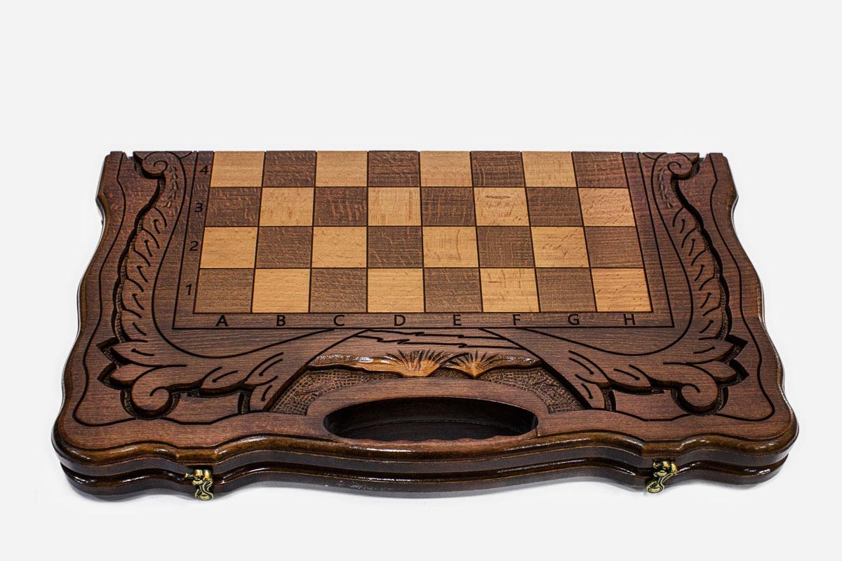 Close-up of the turned chess pieces on the maple and walnut inlaid squares