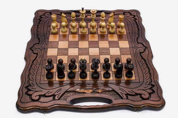Armenian walnut chess set with a Mount Ararat inlay and hand-carved corners, pieces in starting position
