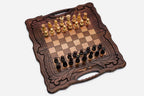 Angled view of the folded walnut chess set with its carved corners