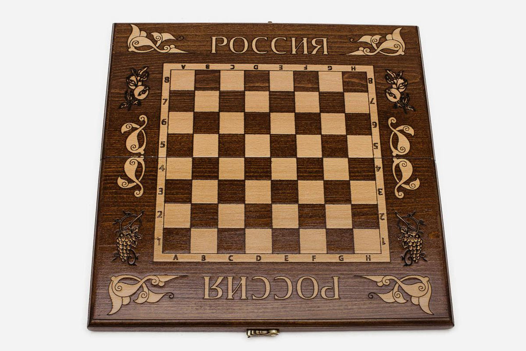 Double-headed eagle emblem hand-carved in deep relief - chess board detail