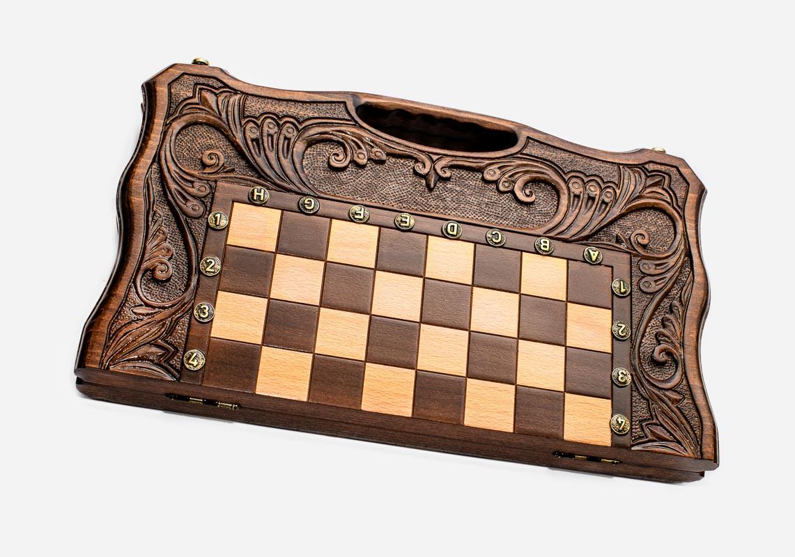 Overhead view of the chess board with the full set of 32 bronze pieces