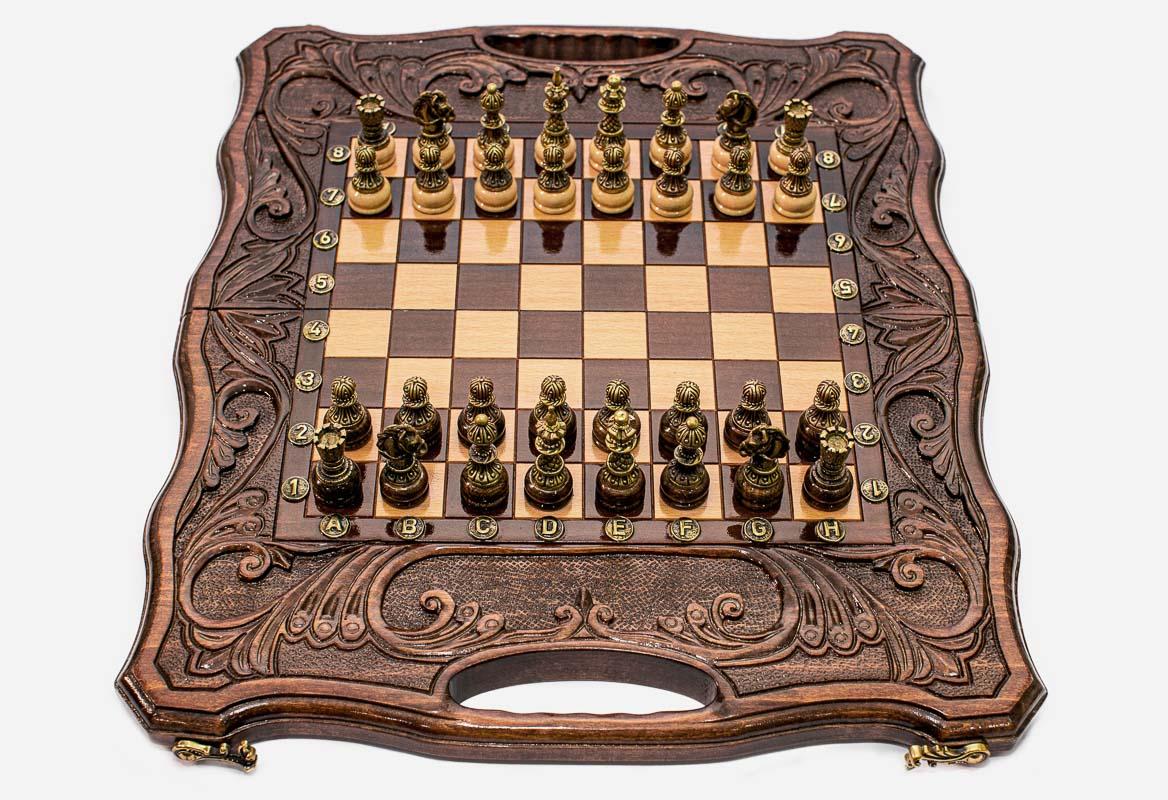 Luxury walnut chess backgammon set with deeply carved borders and an ornate bronze chess army set up for play