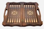 Detail of the deep hand-carved scrollwork running around the walnut border